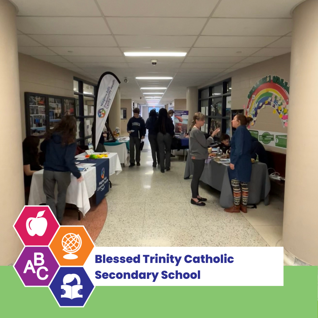 Information booths set up in the school hallway.