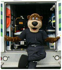 Mascot sitting at back of ambulance