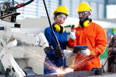 Two employees working in a manufacturing setting