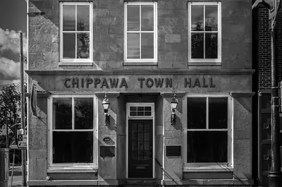 The front facade of the Chippaway Town Hall, which has five windows.