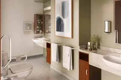 Ensuite bathroom with two sinks and a toilet with accessibility and safety features