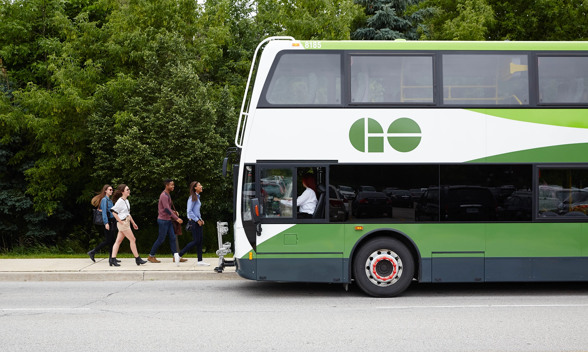 People boarding a GO bus.