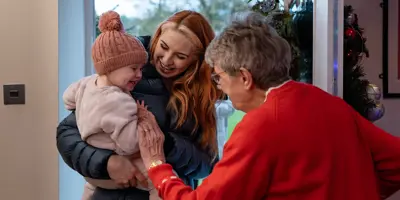 Mother and daughter visiting an elderly family member