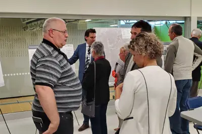Residents talk at the Public Information Centre