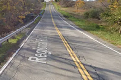 A Google Street View image of Twenty Mile Road as seen from a car