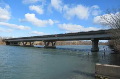 The Stanley Avenue Bridge stands over the water on a sunny day