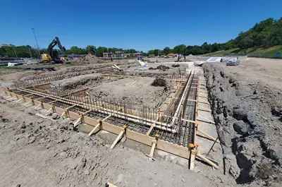 Aeration tank one and two excavation construction. Construction equipment is in the background