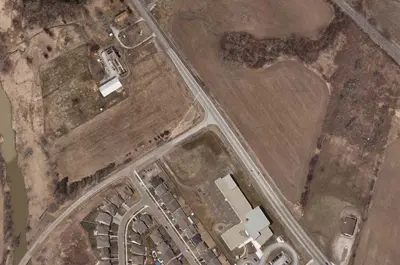 An archival photo shows the intersection of South Grimsby Road 6 and Regional Road 20 West Street prior to construction.