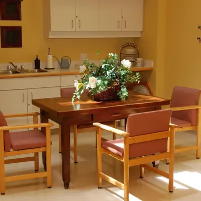 A kitchenette with table and chairs at Linhaven long-term care home
