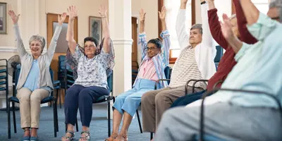 Group of adults doing seated chair exercises