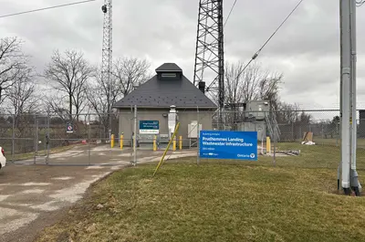 The Victoria Avenue Sewage Pumping Station is a small grey building. A blue sign is visible out front