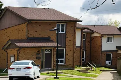 The existing King Street site is a brown brick building with multiple dwellings