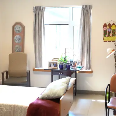A resident's bedroom at Woodlands of Sunset