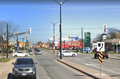 A view of the intersection of Lundy's Lane and Montrose Road in Niagara Falls, including road traffic and local businesses